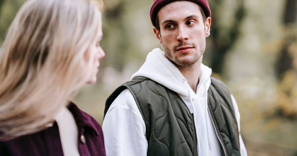 A couple getting to know each other while talking in a park